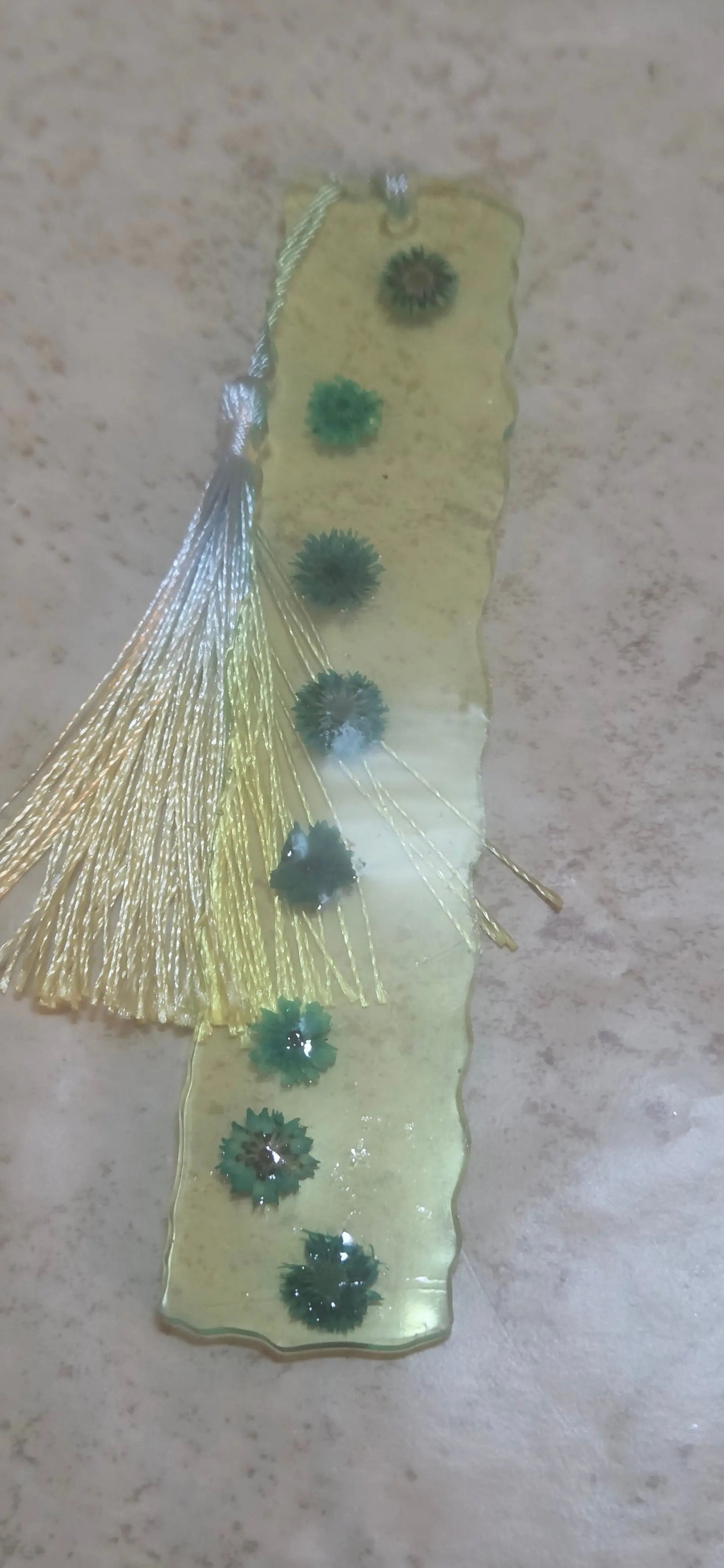 Yellow resin bookmark with wavy edges that about 1.5 inch wide and has blue flowers - Crazy Cat Lady Crafts