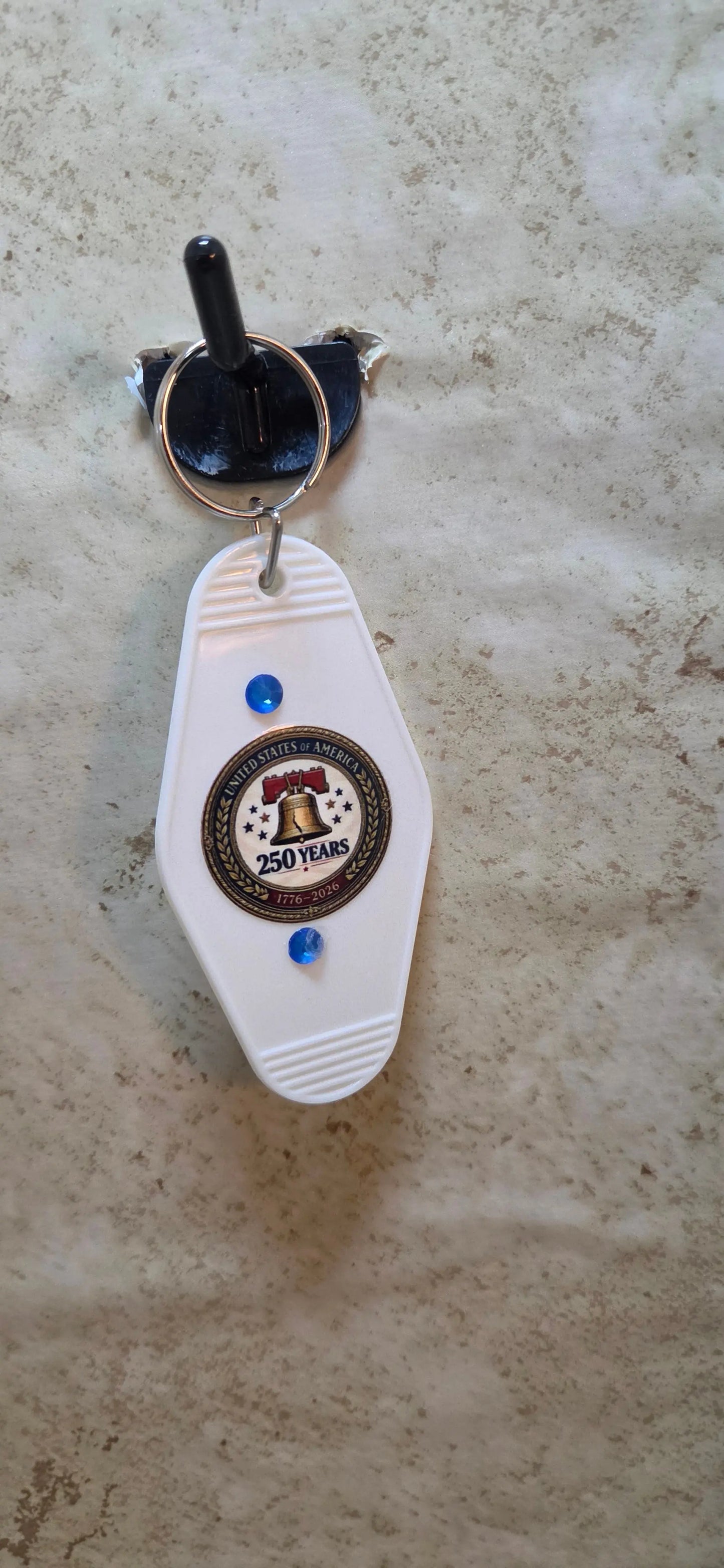 White replica hotel key chain with a Americals 250 and liberty bell - Crazy Cat Lady Crafts