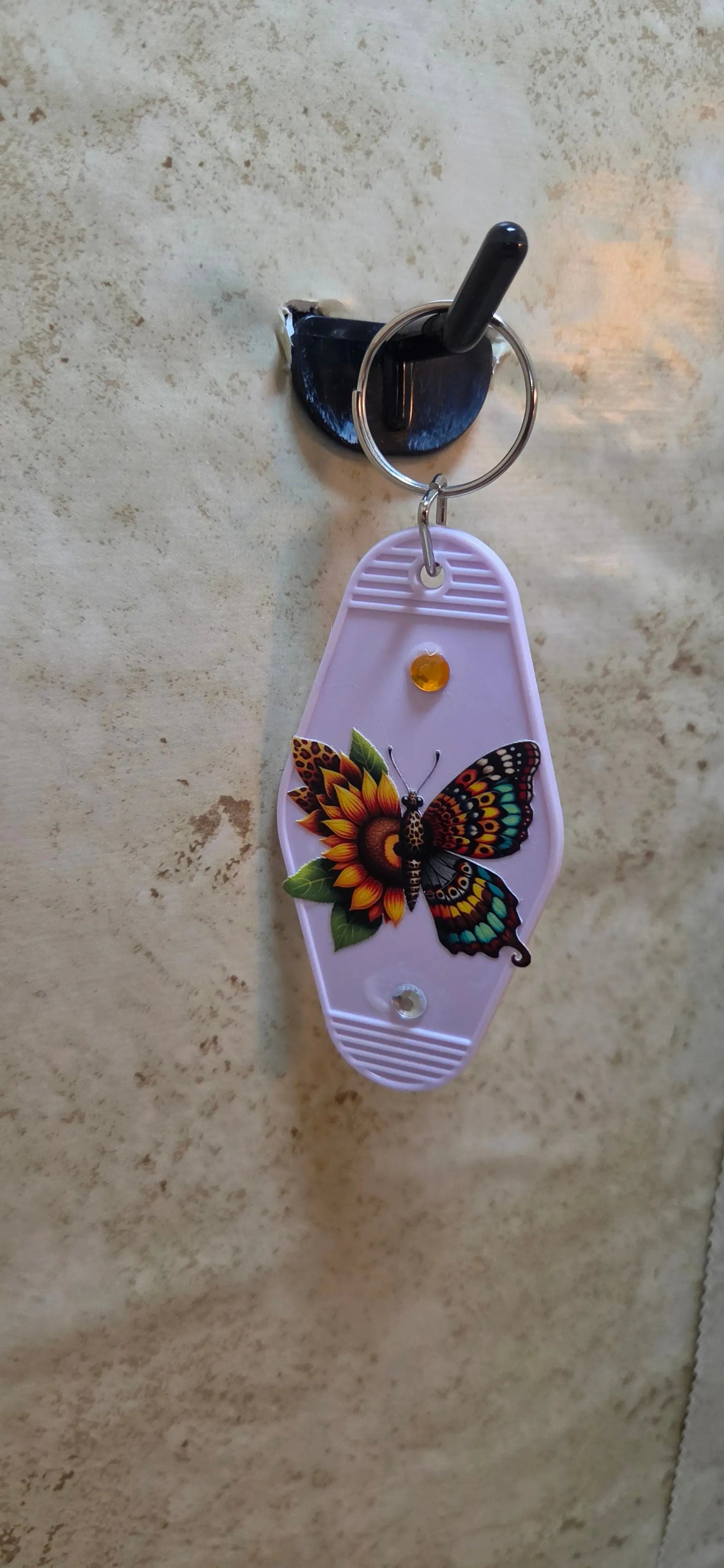 Light pink replica of a hotel key ring with a butterfly made of sunflowers - Crazy Cat Lady Crafts