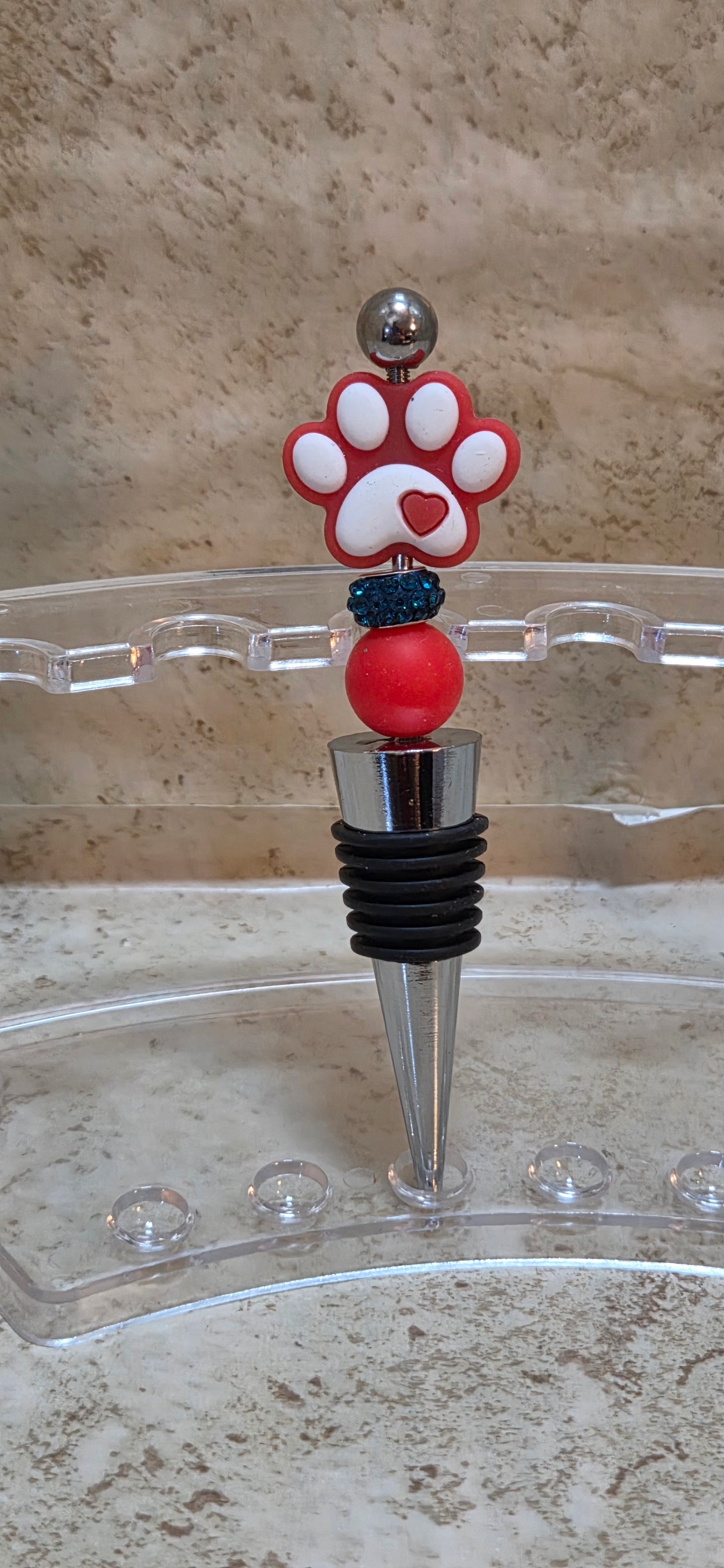 Red silicone paw print metal and rubber wine bottle stopper