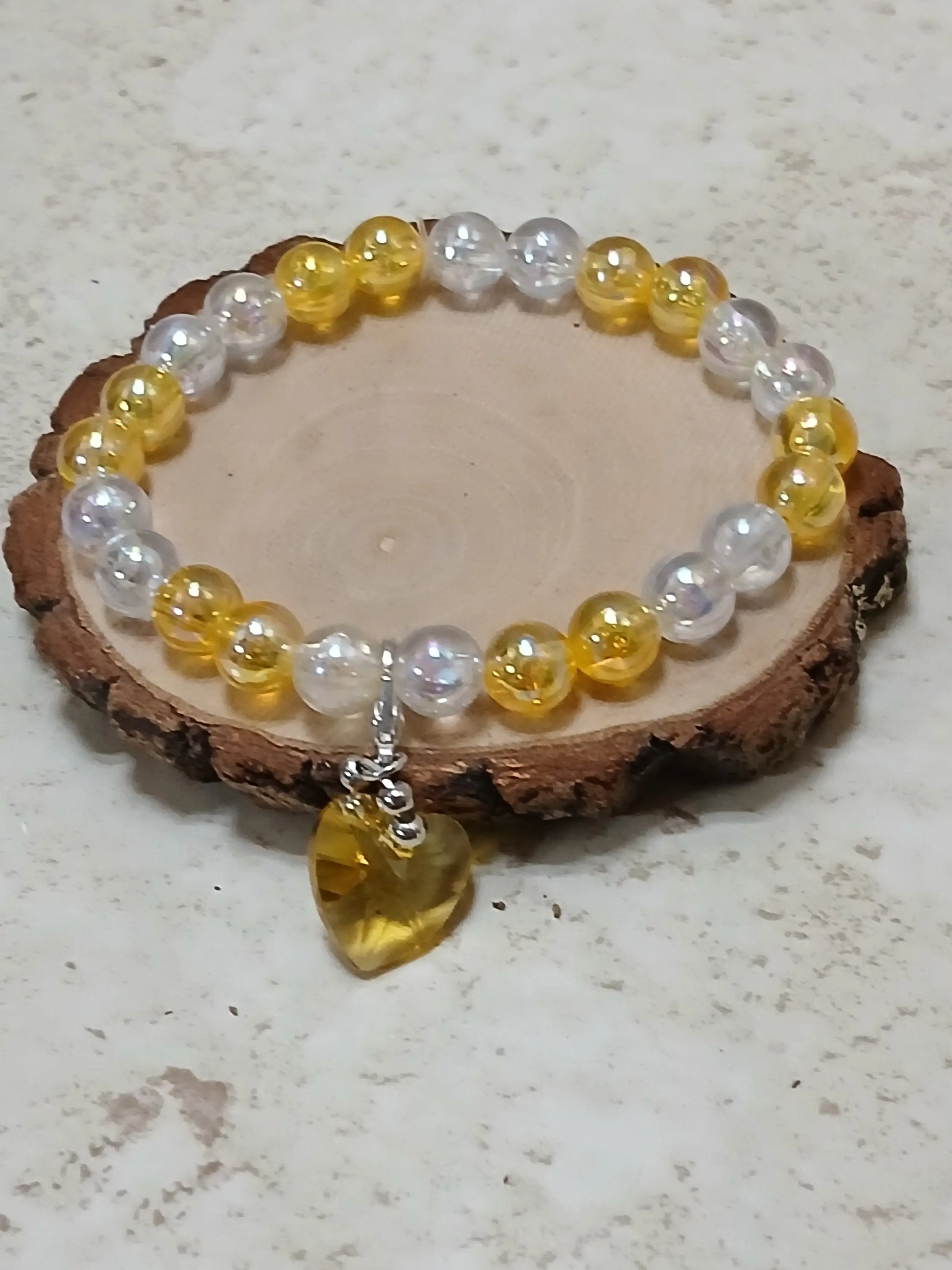 Yellow and white iridescent beaded bracelet with a see thru yellow heart charm - Crazy Cat Lady Crafts
