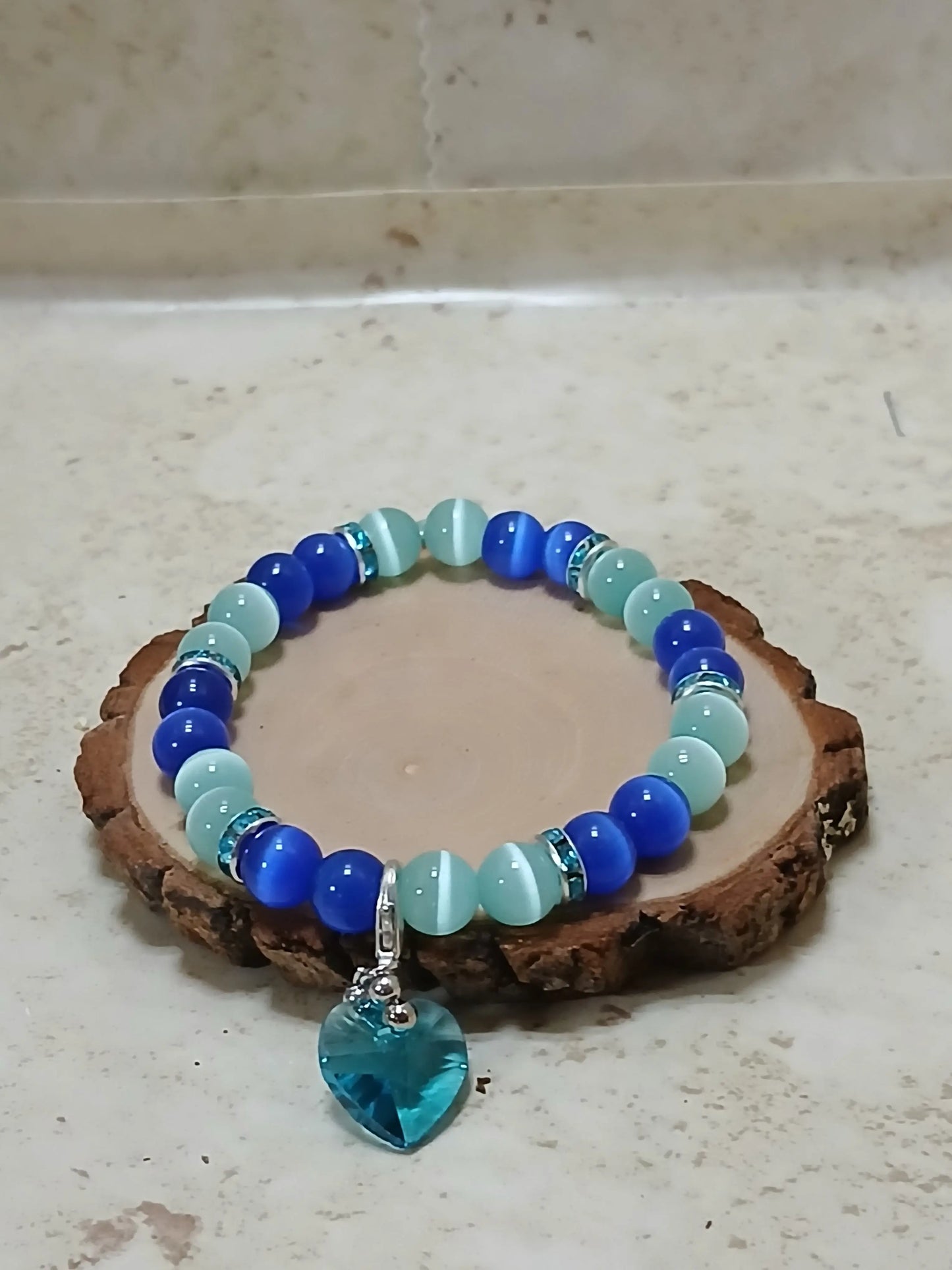 Royal and teal blue cat eye beads and teal spacers stretchy bracelet with teal heart charm - Crazy Cat Lady Crafts