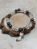 Black and white iridescent beaded stretchy bracelet with white cat charm - Crazy Cat Lady Crafts