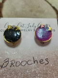2 small round brooches one black and one pink has a gold back and small gold butterflies they also sparkle - Crazy Cat Lady Crafts