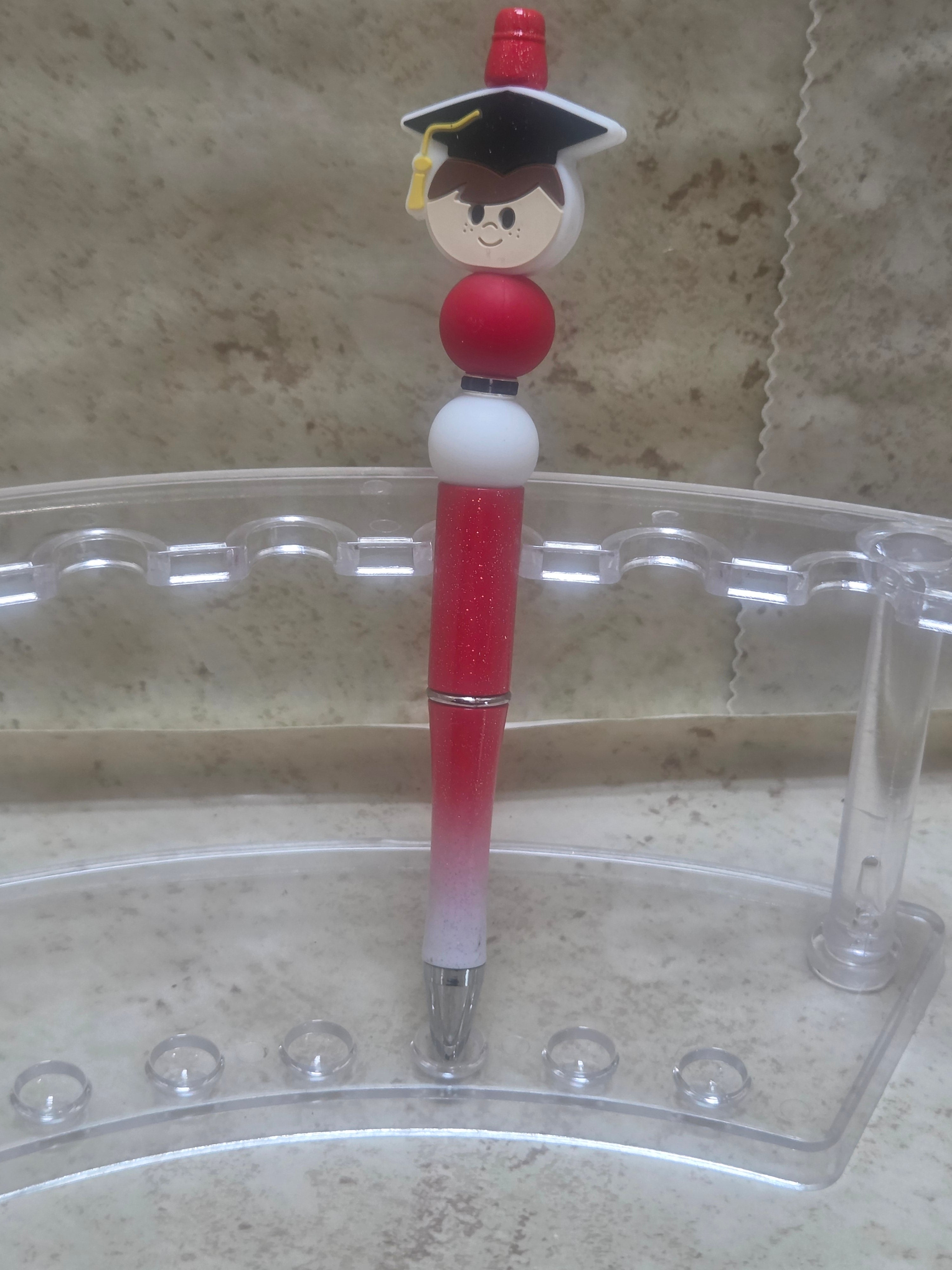 Sparkly red and white ombre barreled pen with red and white silicone beads and a boy graduation pen