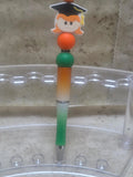 Green white and orange ombre sparkly barreled graduation pen with a girl for the top - Crazy Cat Lady Crafts