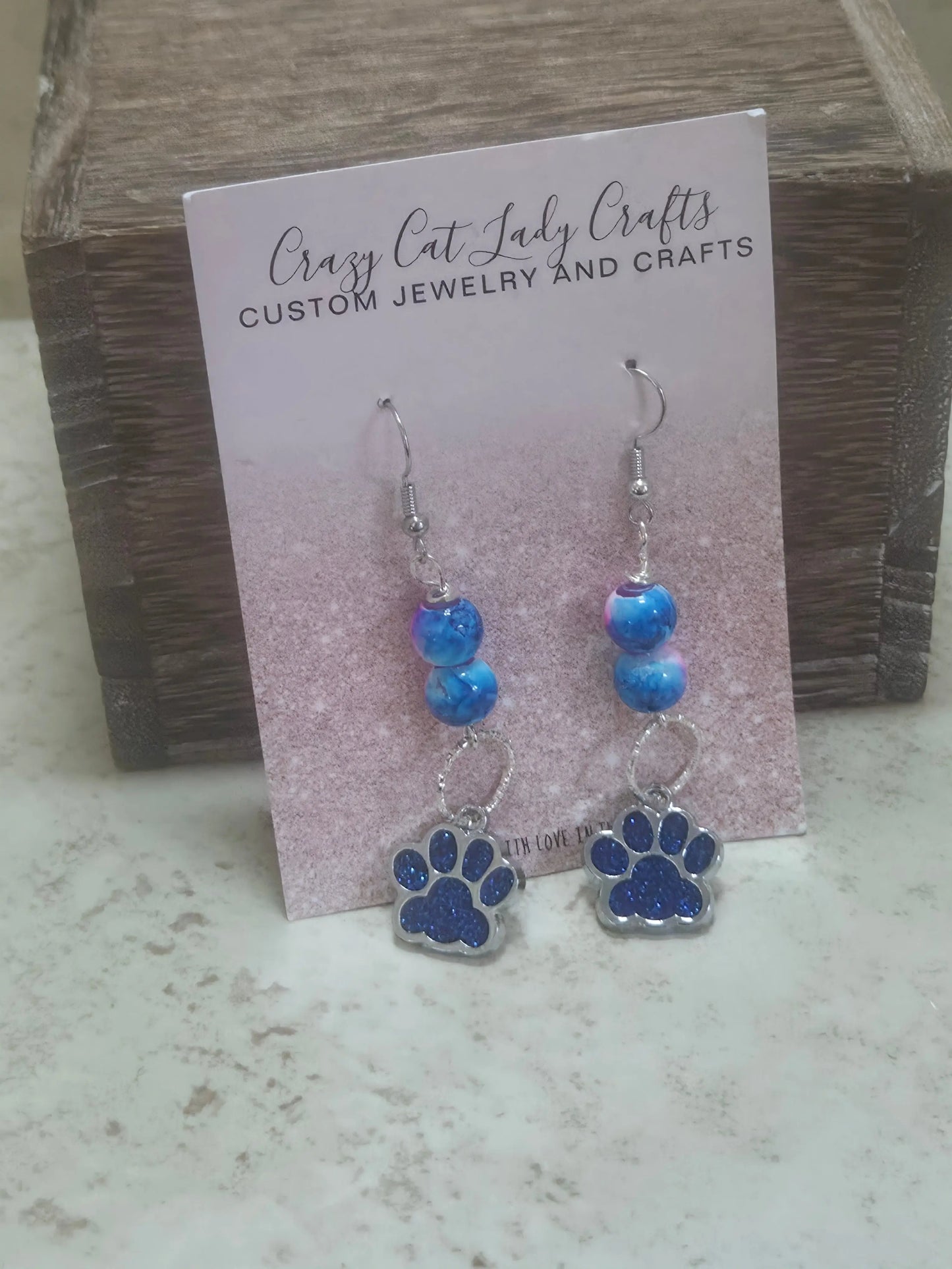 Blue and pink earrings with a blue sparkly paw print - Crazy Cat Lady Crafts