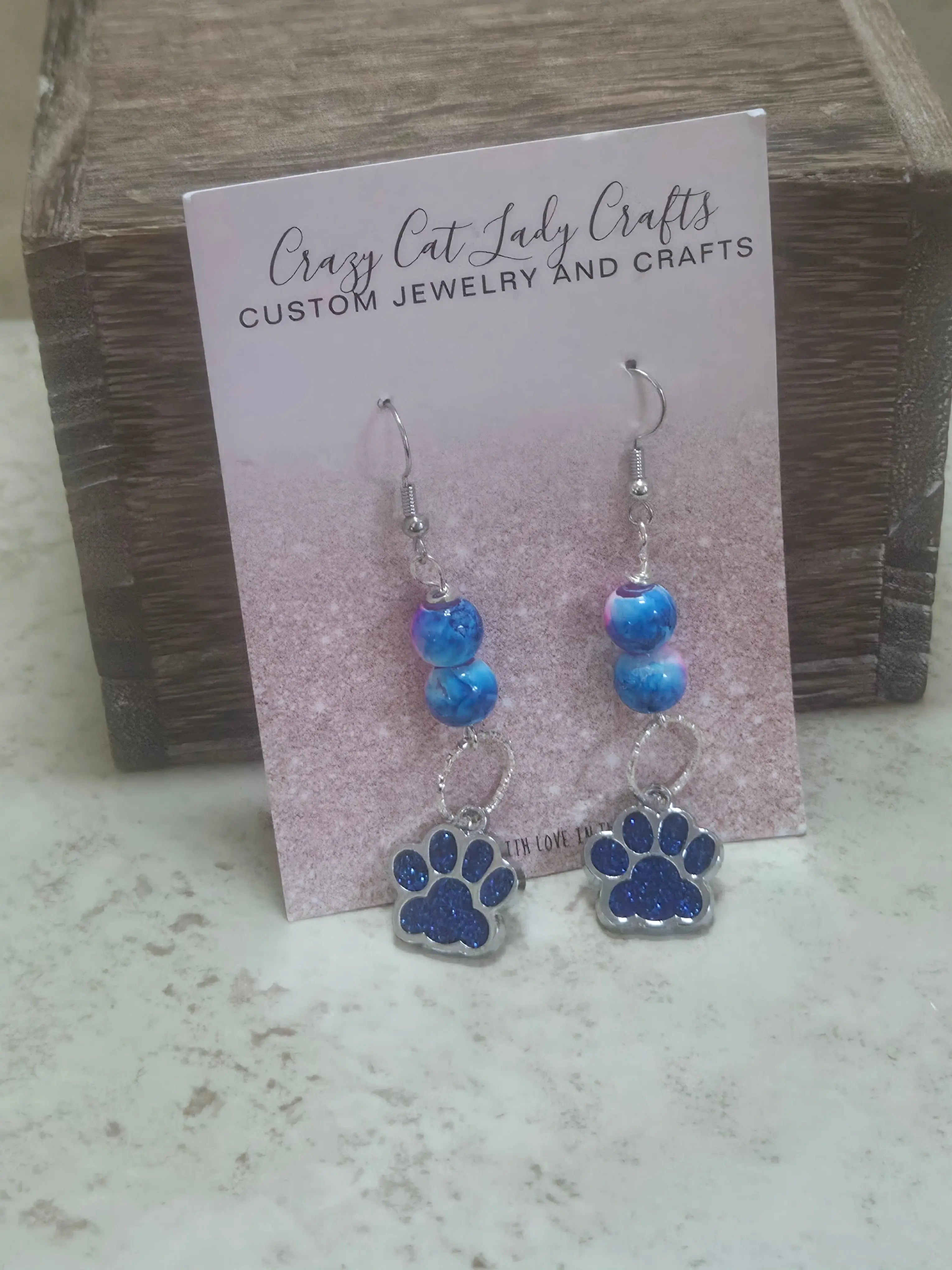Blue and pink earrings with a blue sparkly paw print - Crazy Cat Lady Crafts