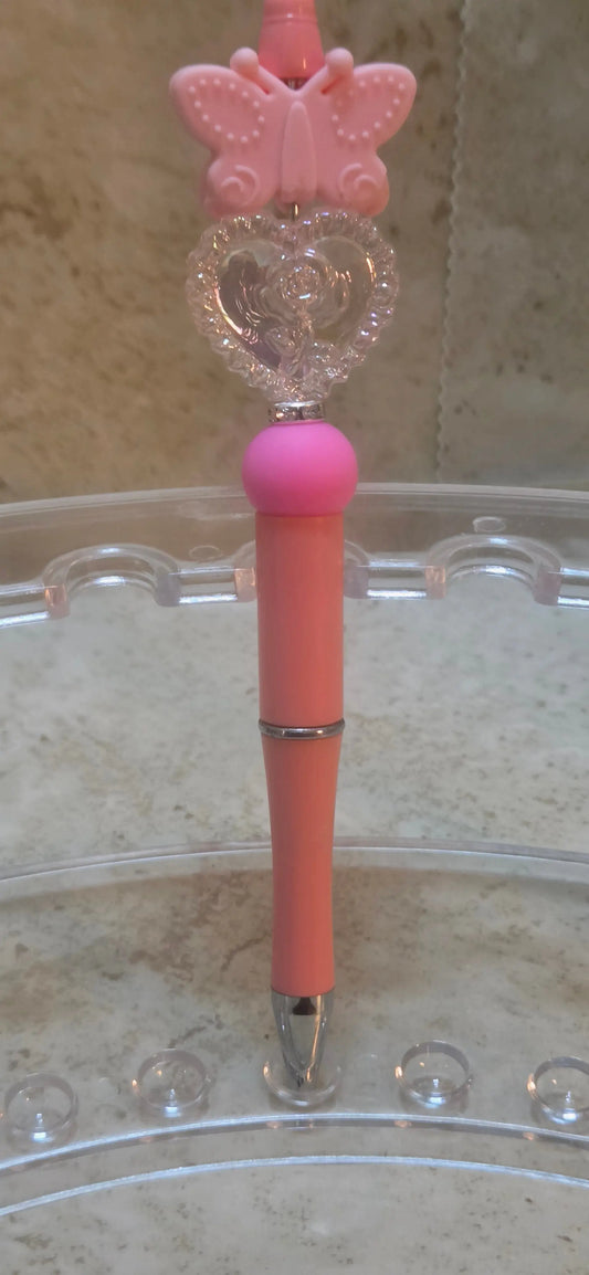 pink silicone butterfly and clear engraved heart shaped beads with a rose pen - Crazy Cat Lady Crafts
