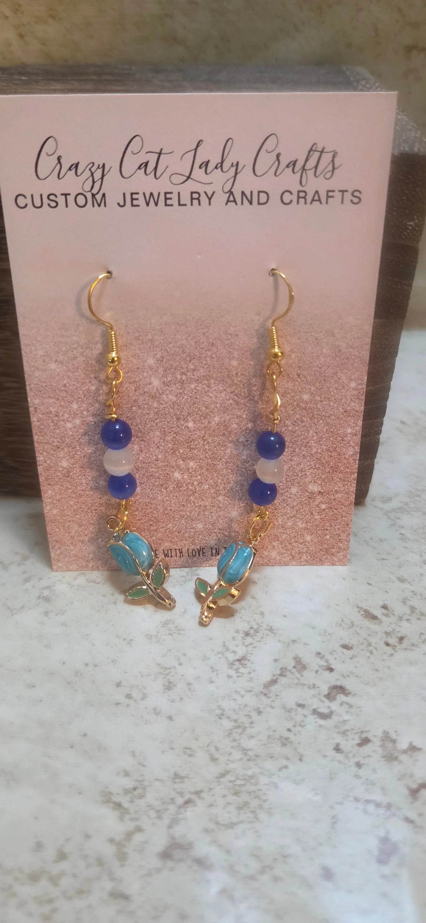 Blue and white beaded earrings with blue tulups charm dangling - Crazy Cat Lady Crafts
