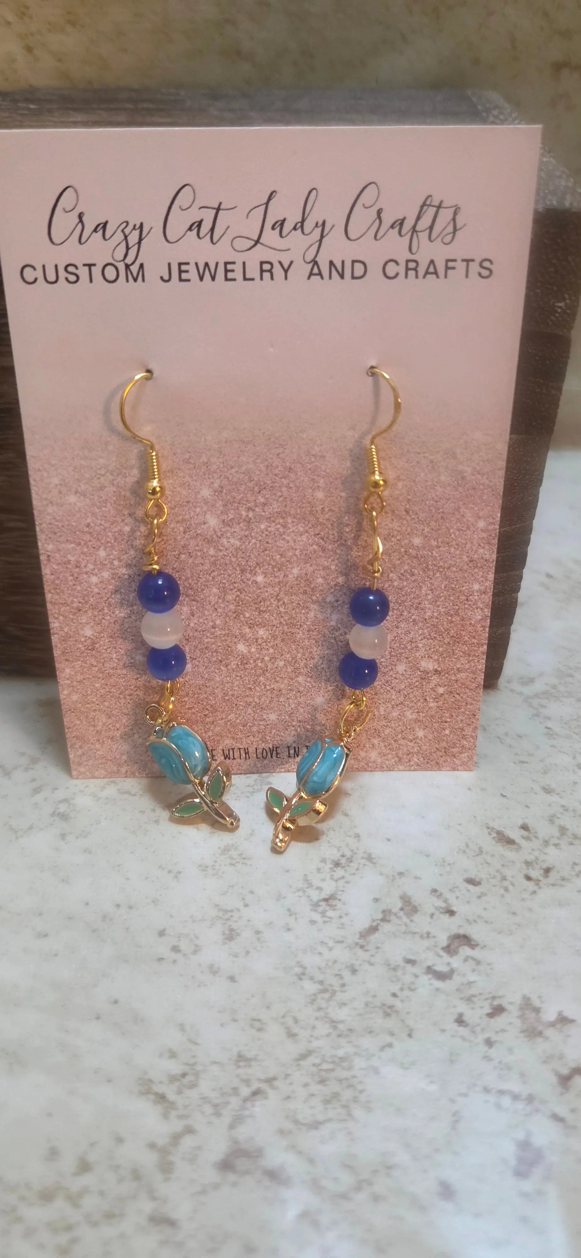 Blue and white beaded earrings with blue tulups charm dangling - Crazy Cat Lady Crafts