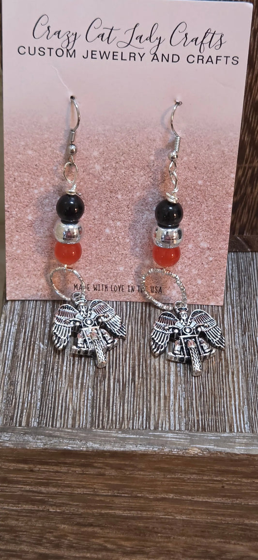Orange silver and black beaded dangle earrings with a silver angel riding a motorcycle - Crazy Cat Lady Crafts