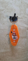 Orange replica hotel key chain with a cartoon sloth in a cup says I hotel Mondays - Crazy Cat Lady Crafts