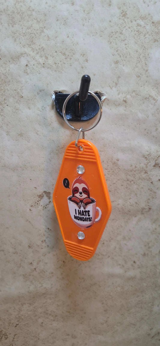 Orange replica hotel key chain with a cartoon sloth in a cup says I hotel Mondays - Crazy Cat Lady Crafts