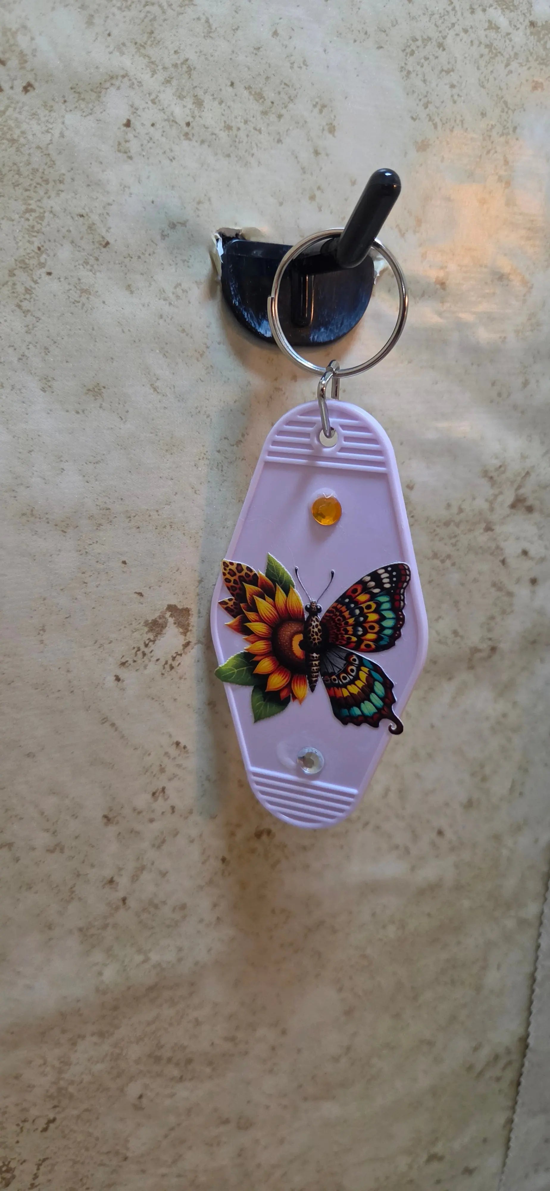Light pink replica of a hotel key ring with a butterfly made of sunflowers - Crazy Cat Lady Crafts