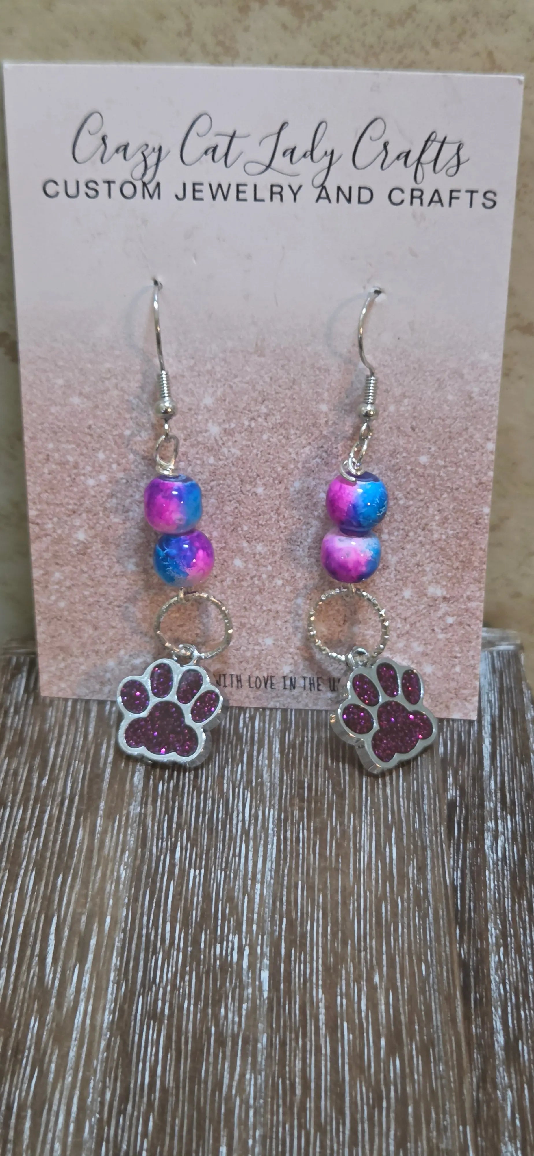 Blue and pink tye dye looking beads and dark pink paw print charm earrings - Crazy Cat Lady Crafts