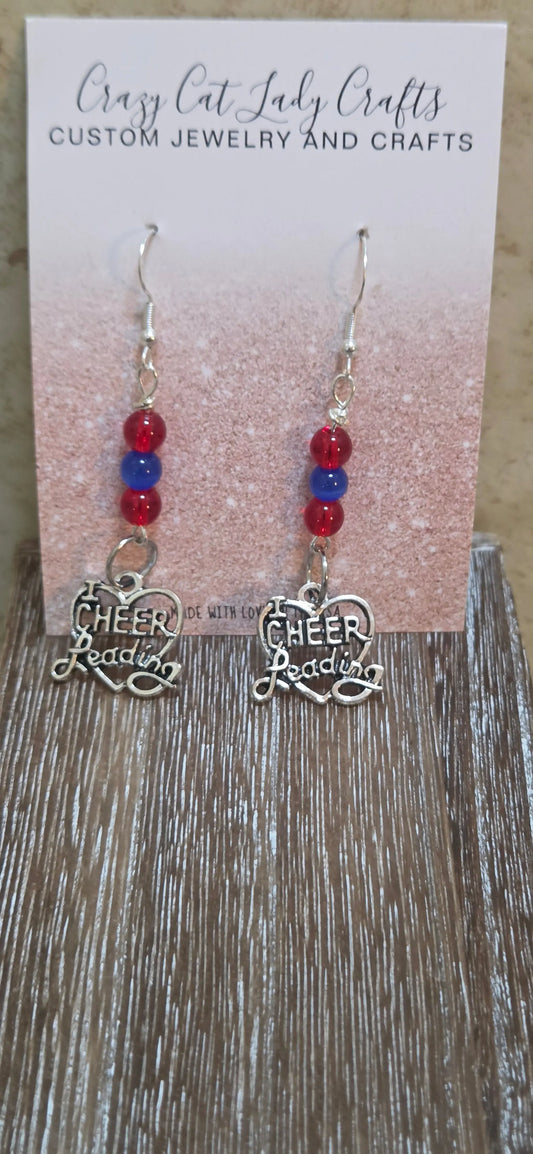 Red and blue with silver charm that says cheerleading earrings - Crazy Cat Lady Crafts