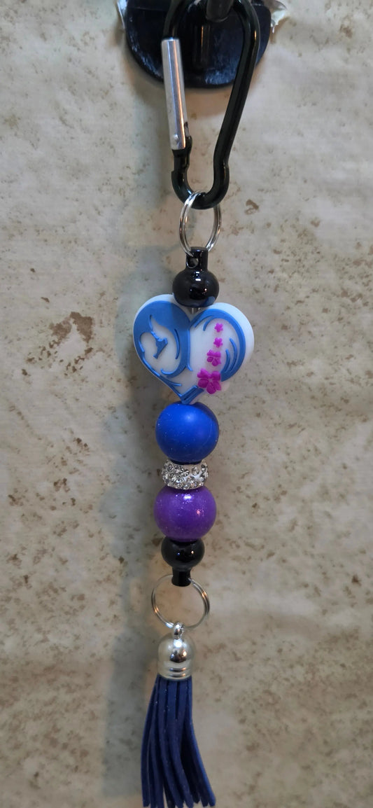 A mother and child in a heart shaped silicone beaded bag tag - Crazy Cat Lady Crafts