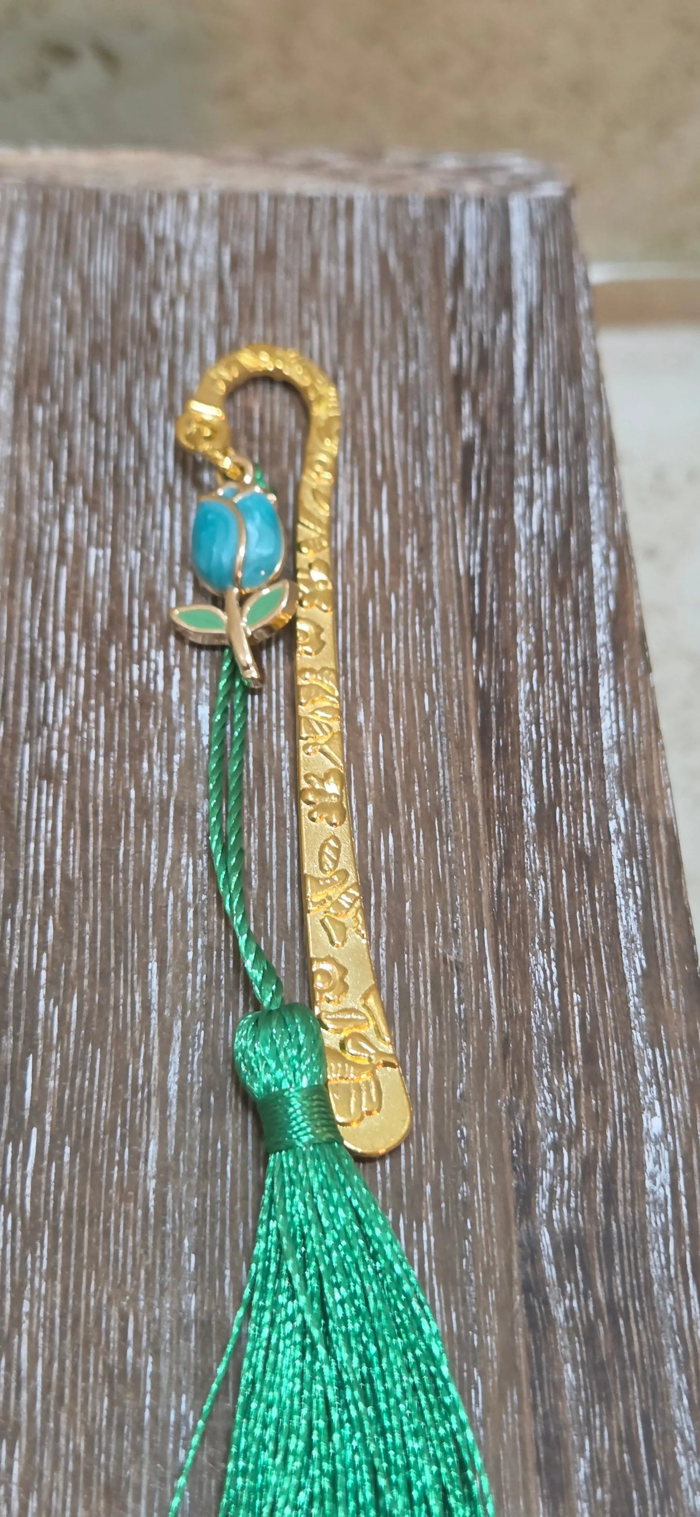 Small gold metal hook with engraved flowers and a blue tulip and green tassel bookmark - Crazy Cat Lady Crafts