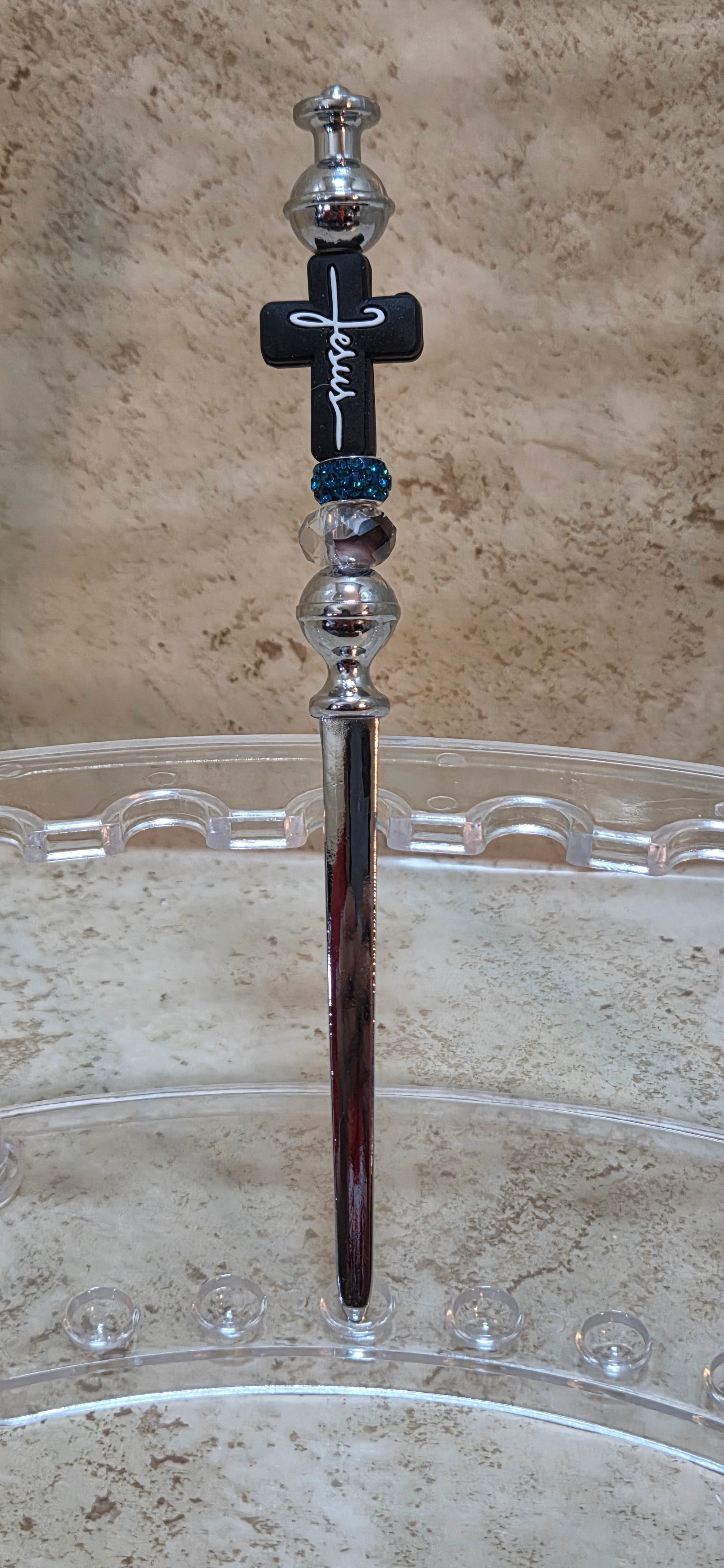 Black cross with white lettering says Jesus and 2 fancy beaded letter opener