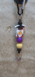 Graduation Gnome in red and black and purple and yellow beads bag tag  with 2026 charm