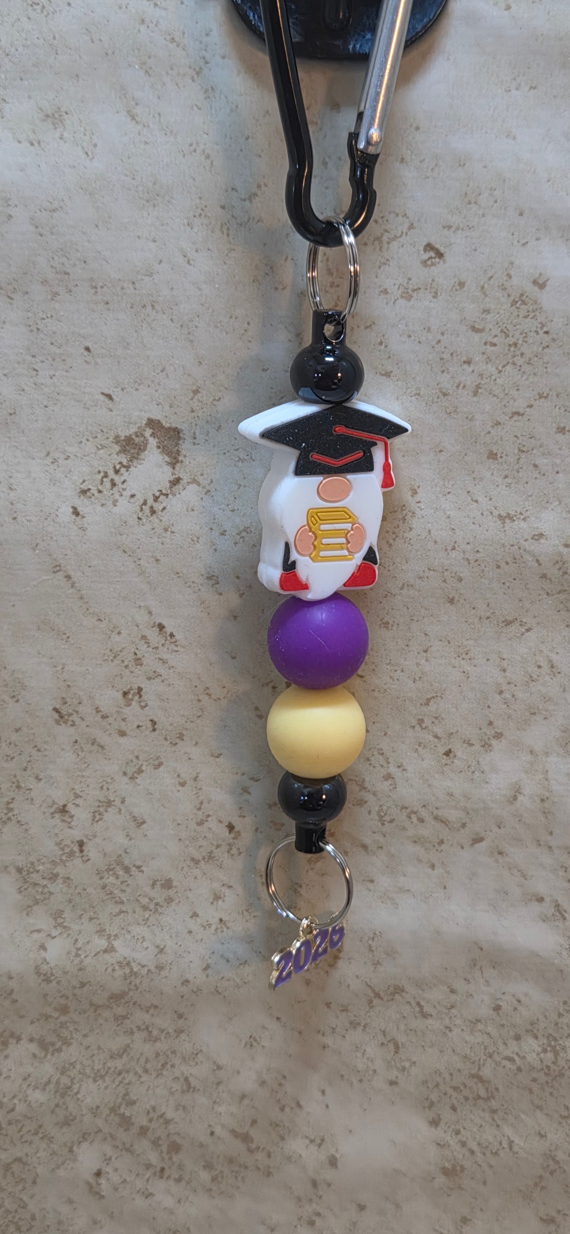 Graduation Gnome in red and black and purple and yellow beads bag tag  with 2026 charm