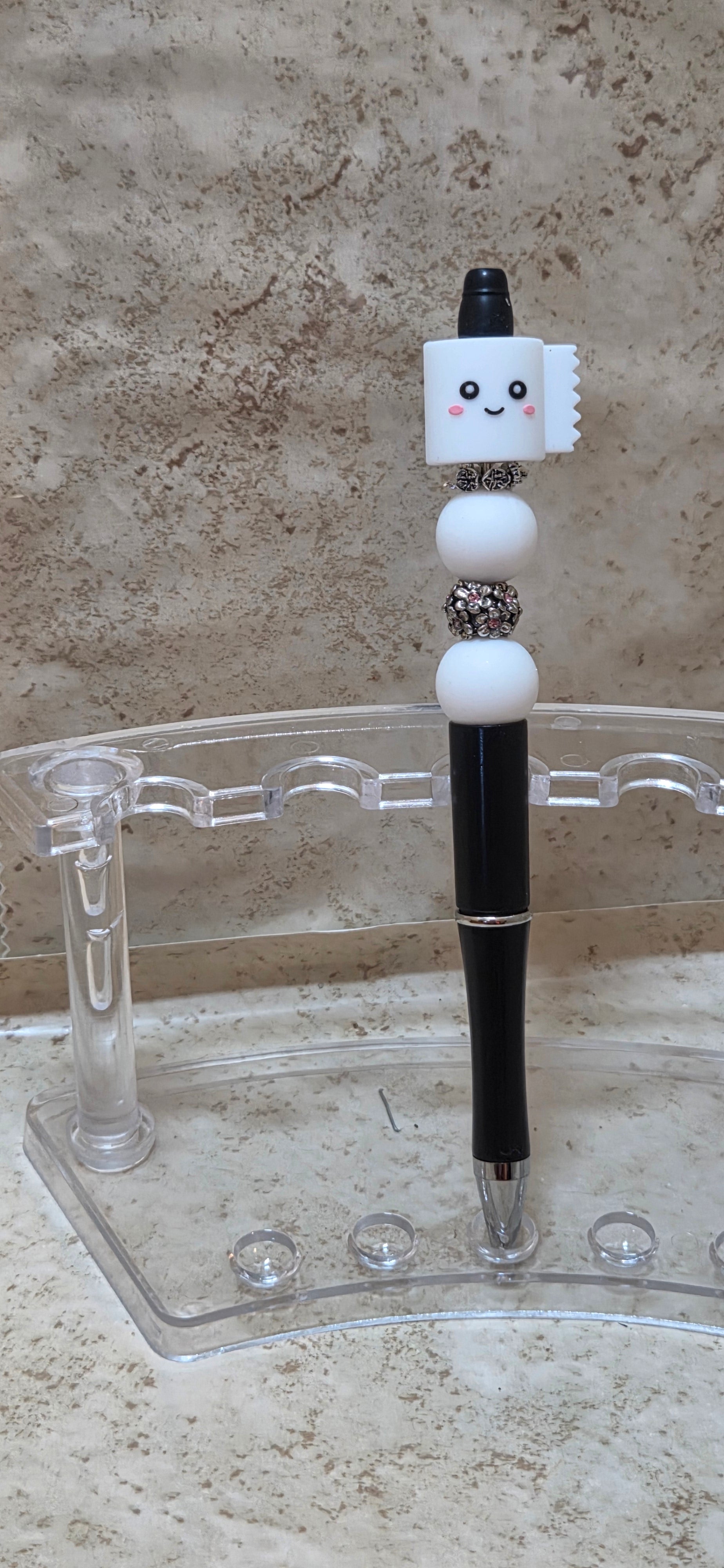 Silicone smiling toilet paper in white and black and white silicone and 2 silver beaded pen