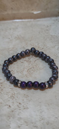 Larger 8.5 size mens  purple and pink swirls and purple with purple swirls stretchy bracelet