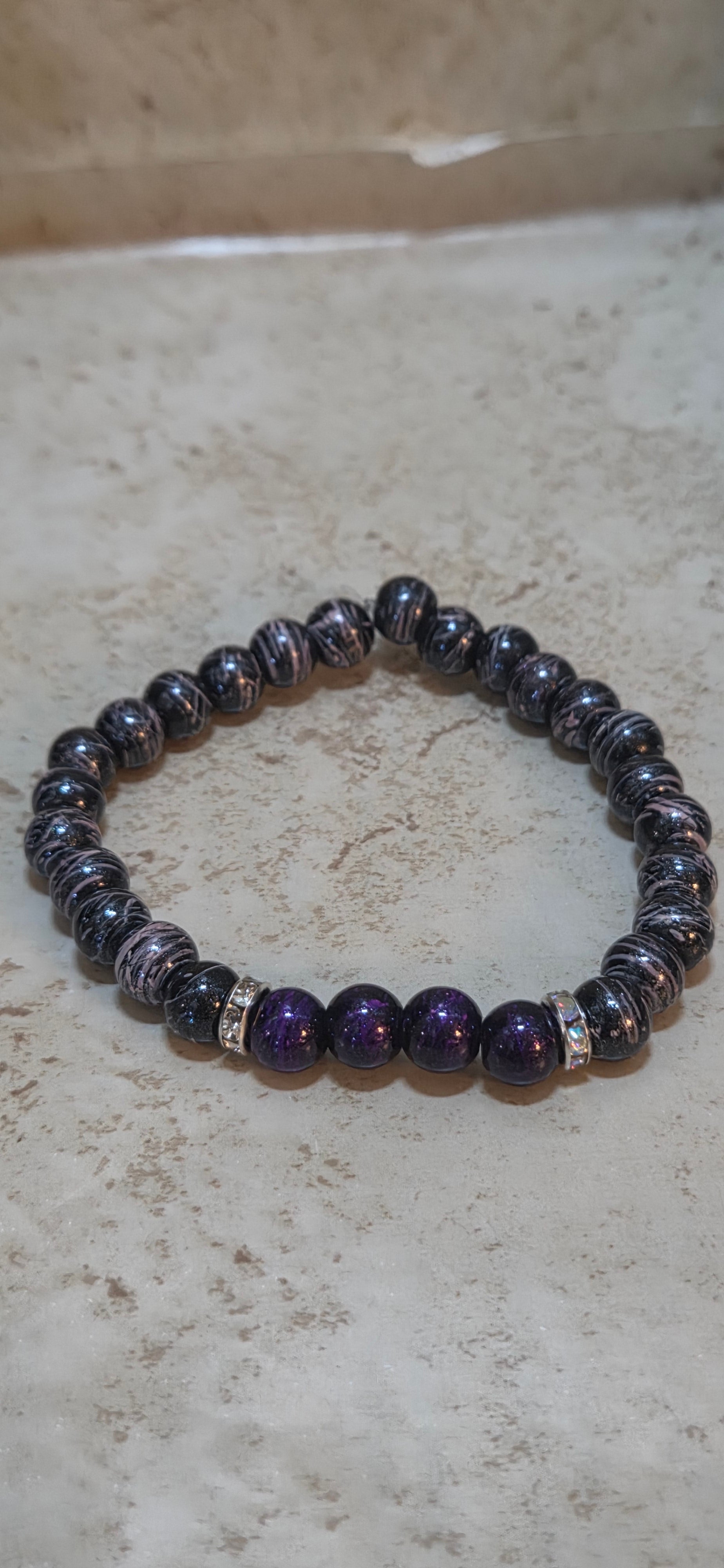 Larger 8.5 size mens  purple and pink swirls and purple with purple swirls stretchy bracelet