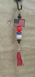 American flag with red white and blue beads and red tassel bag tag
