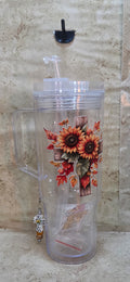 Plastic 40oz tumbler with wooden cross with sunflowers design includes straw and 2 plugs and a black and white cross charm with sparkly orange and brown beads