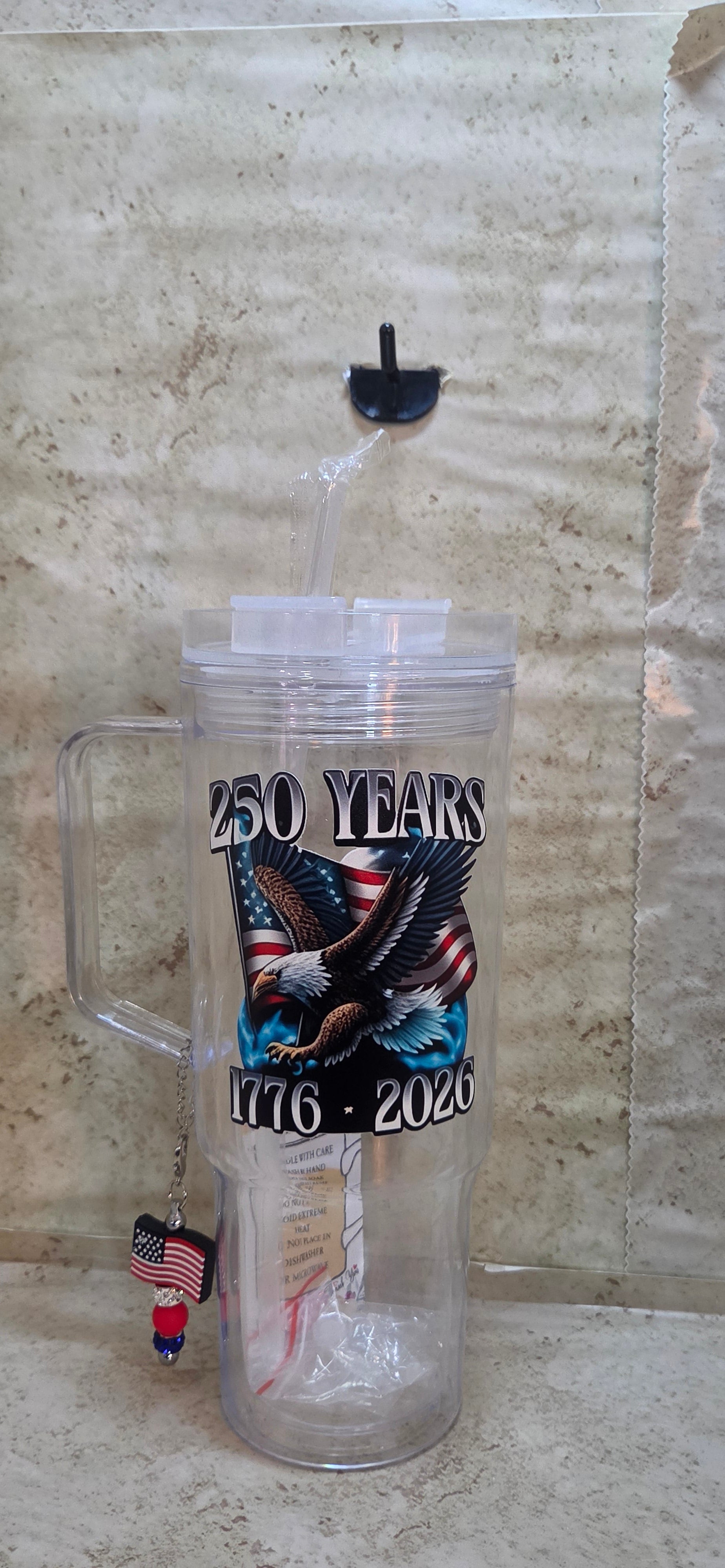 40oz clear tumbler with handle with straw and eagle and 250 birthday design and a flag and sparkly beads charm