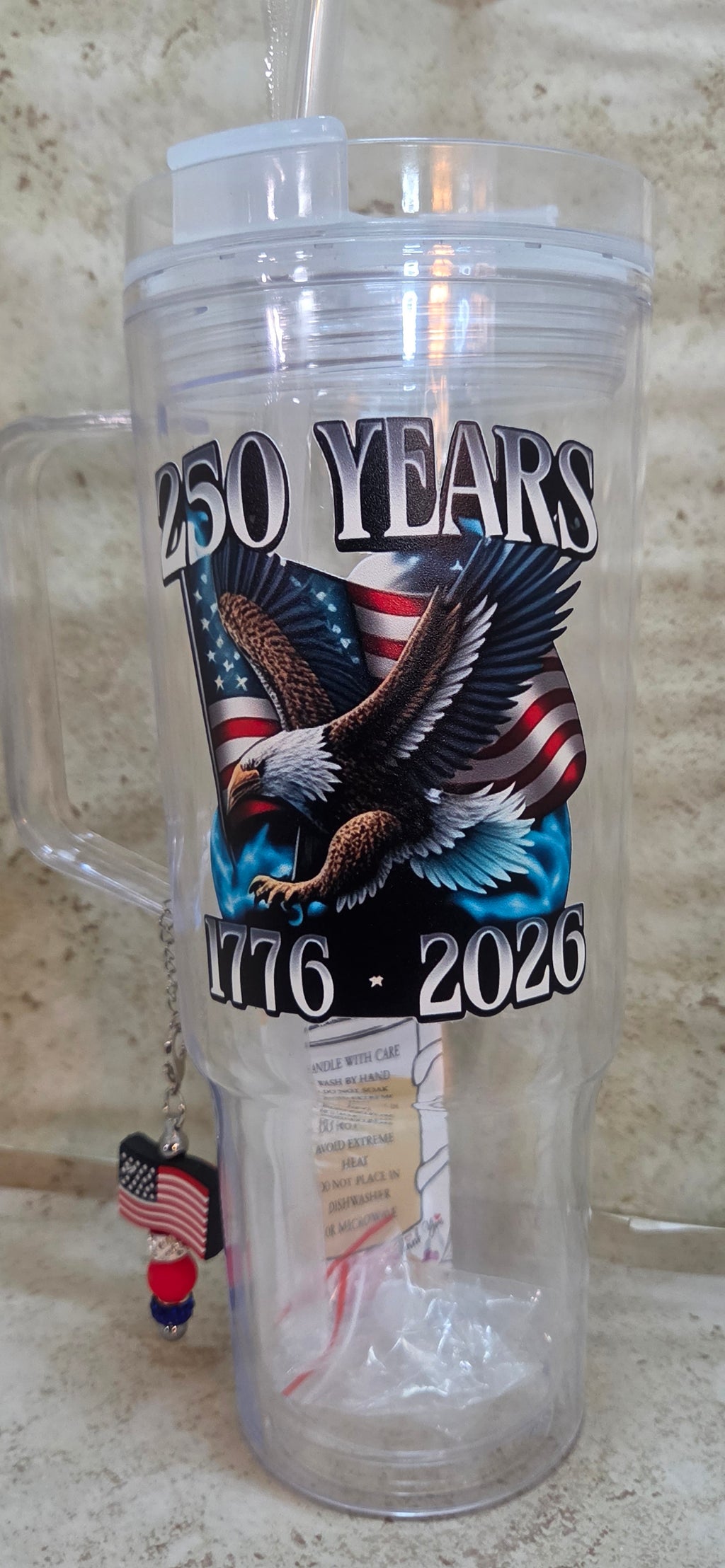40oz clear tumbler with handle with straw and eagle and 250 birthday design and a flag and sparkly beads charm