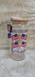 Glass america's 250th with a 4 flag design glass tumbler with wooden top and glass straw and a flag and sparkly beaded sharm