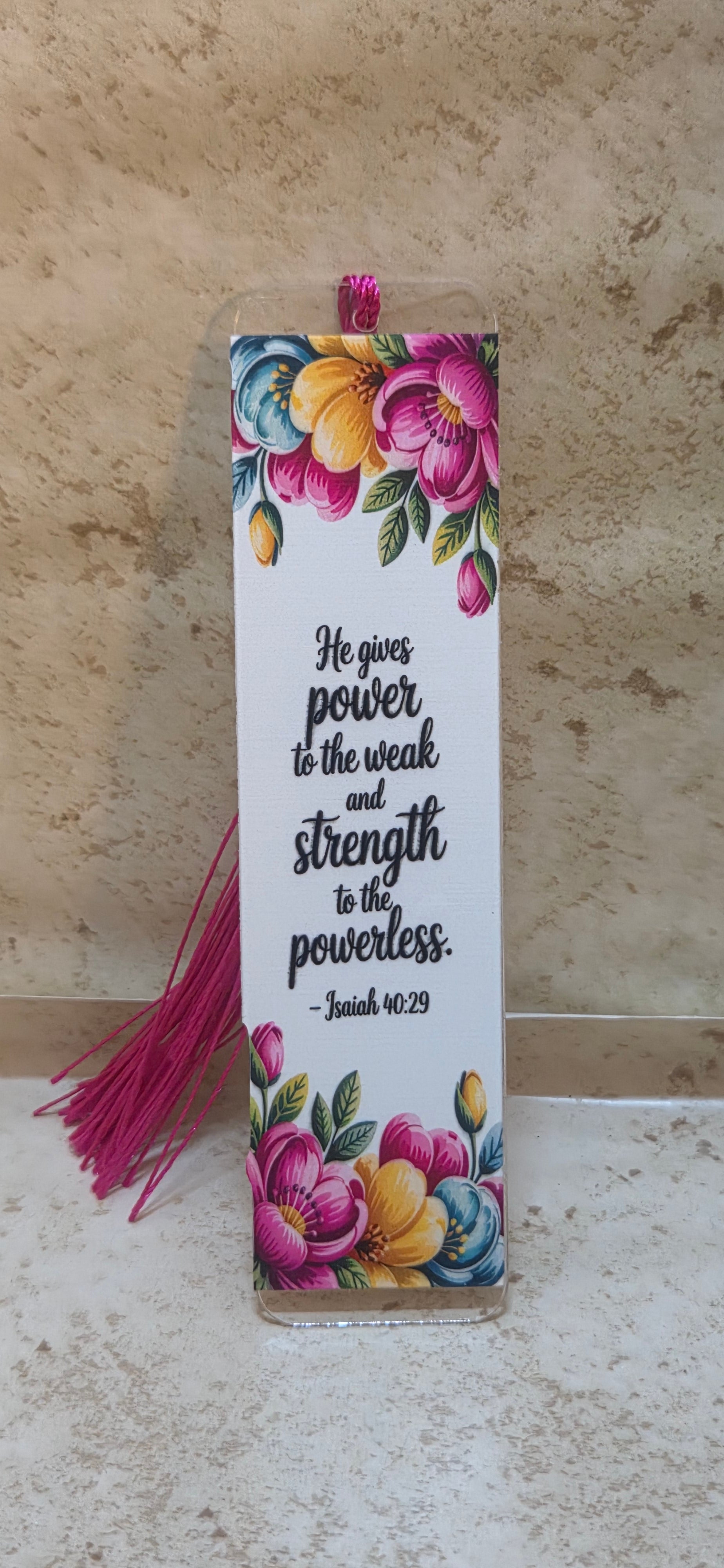 5 inch clear acrylic with a white background and flowers around a bible saying Isaiah 40:29