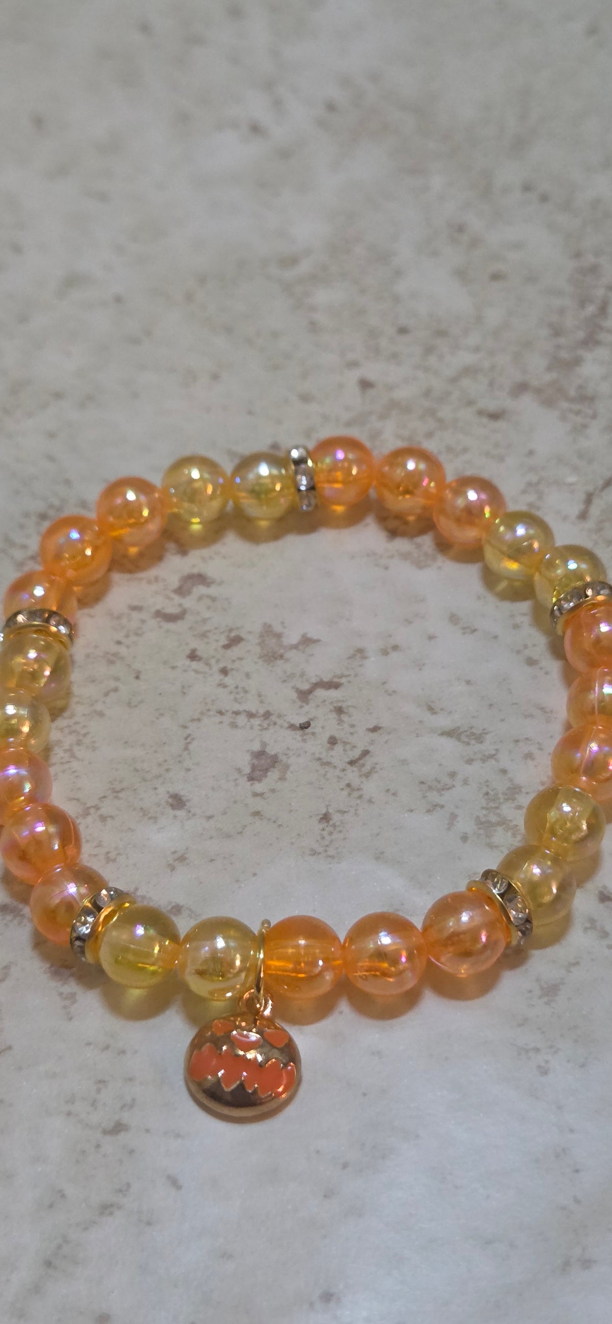 Scary Halloween small pumpkin in orange and yellow stretchy bracelet