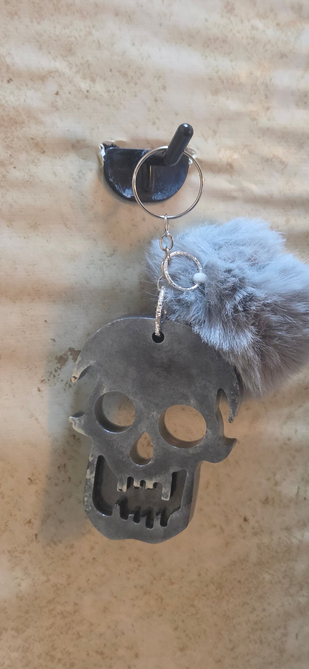 Scary Grey and black resin skull keychain with grey pompom