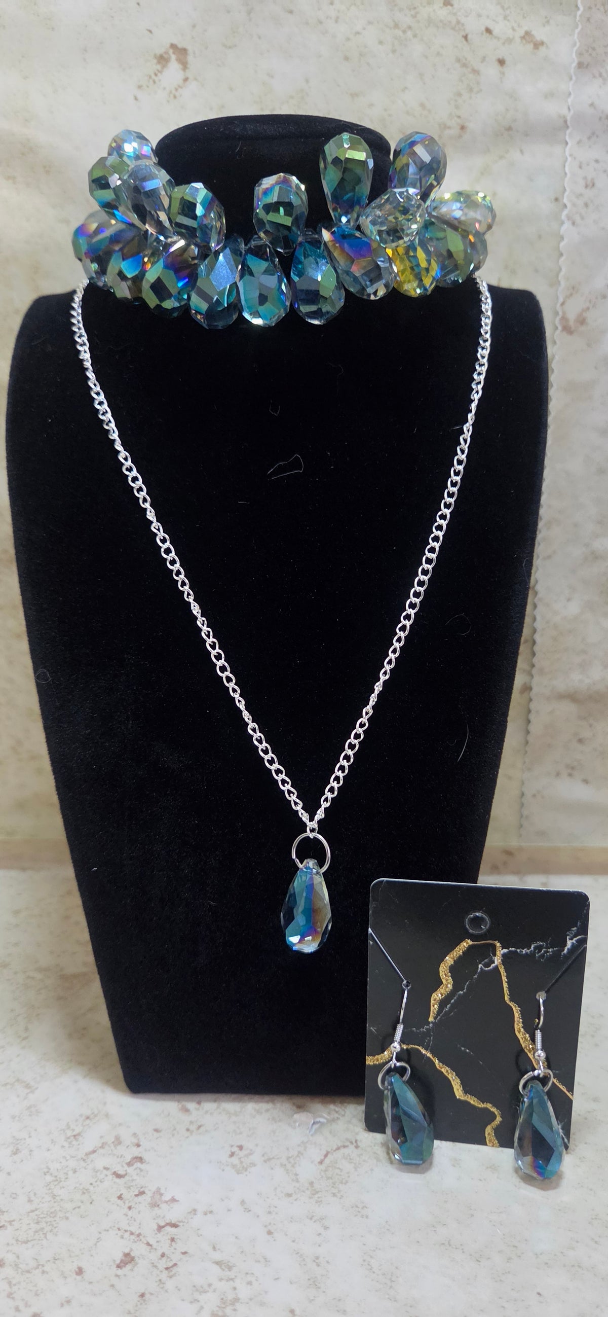 3 pc jewelry set made out of Aura Quartz included is bracelet necklace earrings